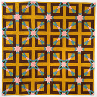 Colorful geometric quilt with mustard yellow, brown, pink, and teal shapes in a repeating pattern, showcasing a modern style by Julia Wachs Designs using the Alcove FPP Quilt Pattern (Download).