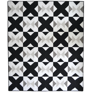 Bedroom Quilt Pattern by Sewn cover flat lay: black, white, and grey flying geese block quilt with bold geometric X and arrow shapes.