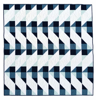 Cirrus Quilt Pattern (Download) by Homemade Emily Jane featuring a modern geometric quilt in navy teal and white with airy cloud inspired movement