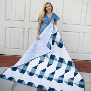 Cirrus Quilt Pattern (Download) by Homemade Emily Jane featuring a modern geometric quilt in white and blue with flowing cloud inspired movement