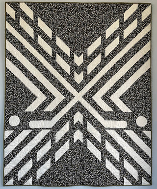Faceoff Quilt Pattern (Download) by Jessica Steele Design black and white geometric quilt with bold angular blocks and hockey inspired symmetry