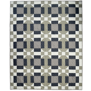 Footpath Quilt Pattern (Download) by Sewn features a modern geometric quilt with neutral shades of gray, black, and white in a repeating block design perfect for confident beginners.