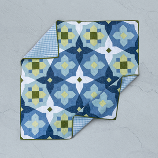 Blue and green geometric patterned quilt with plaid backing, showcasing clean modern quilting by Toad & Sew using the Garden Glow Quilt Pattern (Download).