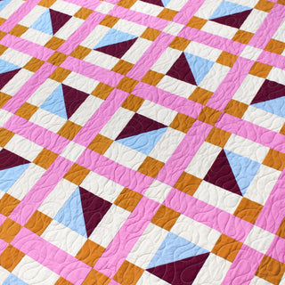 Geometric Glee Quilt Pattern (Download) by Straight Stitching featuring bold geometric blocks with pink sashing and colorful half square triangles