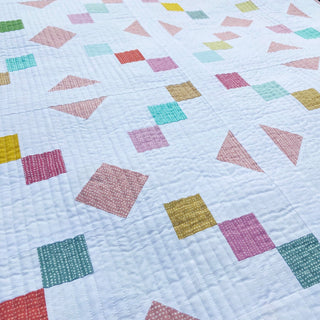Keystone Quilt Pattern (Download) by Homemade Emily Jane featuring a modern geometric quilt design with colorful squares and triangles on a white background