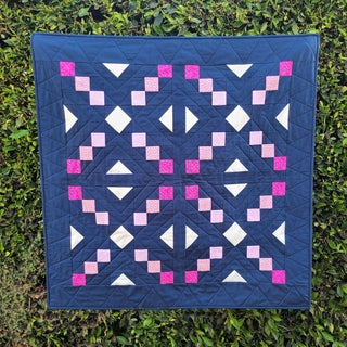 Keystone Quilt Pattern (Download) by Homemade Emily Jane featuring a modern geometric quilt with balanced symmetry and navy pink and white fabric shapes