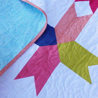 Limelight Quilt Pattern (Download) by Homemade Emily Jane featuring bold geometric shapes in pink blue green and coral with clean white negative space