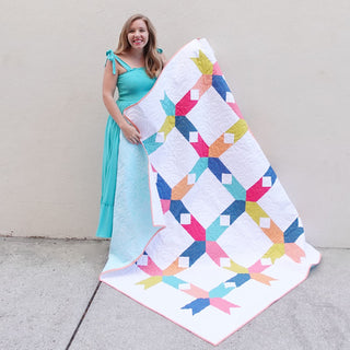Limelight Quilt Pattern (Download) by Homemade Emily Jane featuring a colorful modern geometric quilt with bold shapes and white negative space