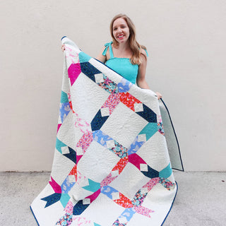 Limelight Quilt Pattern (Download) by Homemade Emily Jane featuring a colorful modern geometric quilt with bold shapes and white negative space