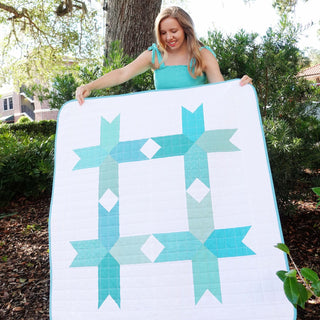 Limelight Quilt Pattern (Download) by Homemade Emily Jane featuring a modern turquoise geometric quilt with bold shapes and white negative space