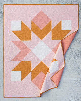 Mt. Mitchell Quilt Pattern (Download) by Hampton Quilt Studio featuring a beginner-friendly pink and orange geometric half-square triangle quilt design