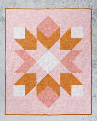 Mt. Mitchell Quilt Pattern (Download) by Hampton Quilt Studio featuring a pink orange and white geometric half square triangle quilt design