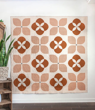 Decorative wall tapestry with geometric pattern on a white wall