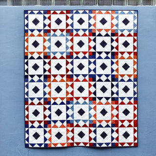 Reverberate Quilt Pattern (Download) modern geometric quilt with repeating diamond blocks in navy red orange and white by Homemade Emily Jane