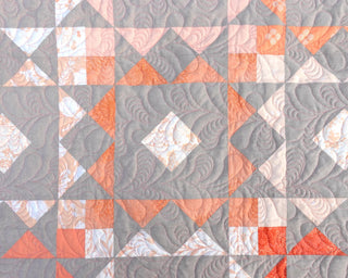 Reverberate Quilt Pattern (Download) by Homemade Emily Jane featuring a modern geometric quilt design in coral gray and white with repeating angular shapes