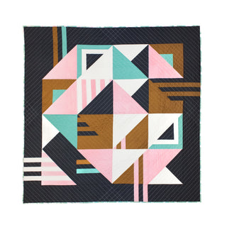 Modern geometric quilt featuring teal, pink, white, brown, and black shapes, showcasing the Sincerely Quilt Pattern (Download) by Eudaimonia Studio with clean lines and a contemporary design.