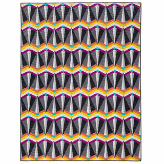 Colorful geometric quilt with sharp triangular shapes in shades of gray, orange, yellow, purple, and teal, made using the Skye FPP Quilt Pattern (Download) by Julia Wachs Designs.