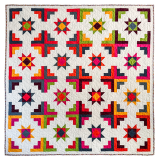 Colorful patchwork quilt featuring star and cross block patterns on a white background, showcasing the Solstice Burst Quilt Pattern (Download) by A Piece of Quiet Quilts.