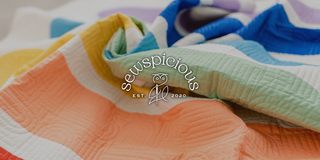 Colorful fabric with 'seuspicious' brand logo in the center.