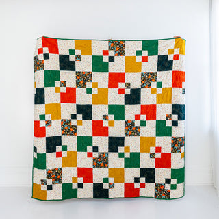 Colorful Welcome Party quilt by Trace Creek Quilting on a white background