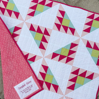 Brazen Quilt Pattern (Download) by Homemade Emily Jane, featuring a modern geometric quilt in pink, aqua, lime, and white with bold starburst blocks