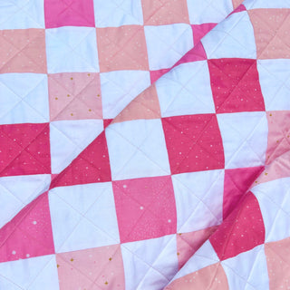 Doubled Up Quilt Pattern (Download) by Homemade Emily Jane featuring a modern geometric quilt in pink coral and white with layered square blocks and bold movement
