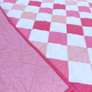 Doubled Up Quilt Pattern (Download) by Homemade Emily Jane featuring a pink and white geometric patchwork quilt with layered squares and triangles