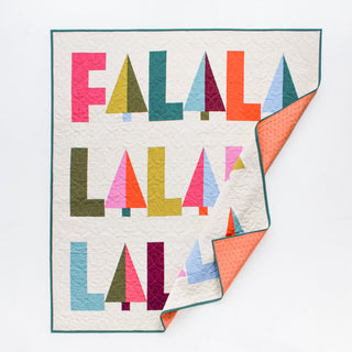 Fa-La-La Quilt Pattern (Download) by Patternly Collective featuring a festive modern quilt with colorful geometric Fa La La lettering and folded corner details