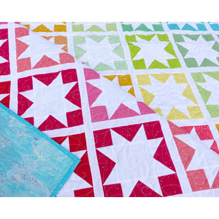 Keepsake Quilt Pattern (Download) by Homemade Emily Jane showing colorful star quilt blocks in red pink yellow green and turquoise fabrics