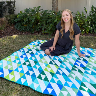 Kinetic Quilt Pattern (Download) by Homemade Emily Jane featuring a vibrant modern geometric quilt in blue teal green and white with dynamic movement