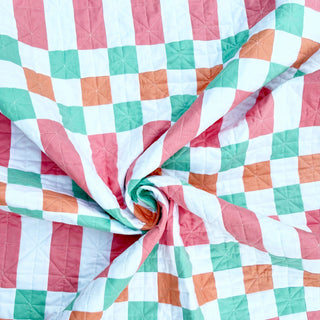 Linear Quilt Pattern (Download) by Homemade Emily Jane featuring a modern geometric quilt in coral teal orange and white with bold grid blocks and soft gathered movement