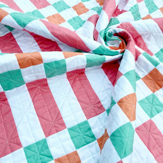 Linear Quilt Pattern (Download) by Homemade Emily Jane featuring a colorful modern geometric quilt with pink teal orange and white patchwork blocks and gentle quilting