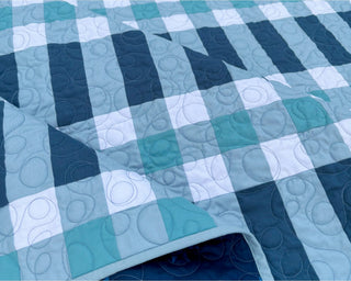 Linear Quilt Pattern (Download) by Homemade Emily Jane featuring a modern geometric quilt in teal blue and white with bold linear blocks and soft circular quilting