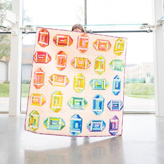 Log Cabin Lateral Quilt Pattern (Download) by Jessica Steele Design featuring a colorful modern quilt with playful geometric blocks in bright rainbow hues