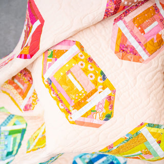 Log Cabin Lateral Quilt Pattern (Download) by Jessica Steele Design, featuring a colorful modern quilt with bright improv log cabin blocks and soft quilting.