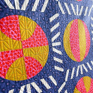 Nothin' But Net Quilt Pattern (Download) by Jessica Steele Design featuring colorful basketball blocks and basketball net inspired strip pieced sashing
