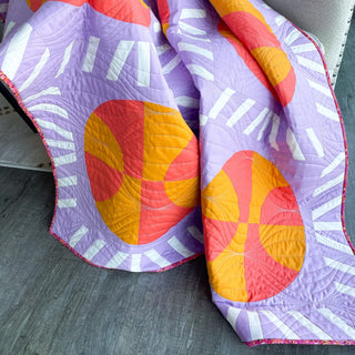 Nothin' But Net Quilt Pattern (Download) by Jessica Steele Design featuring colorful basketball blocks and net-inspired strip pieced sashing on a modern quilt.