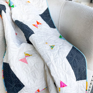 Soccer Party Quilt Pattern (Download) by Jessica Steele Design, modern white quilt with navy soccer ball panels and colorful geometric accents