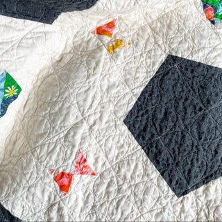 Soccer Party Quilt Pattern (Download) by Jessica Steele Design featuring a modern geometric quilt with white fabric black shapes and colorful accents