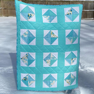 Solitaire Quilt Pattern (Download) by Homemade Emily Jane featuring a turquoise modern quilt with geometric patchwork blocks and white accents